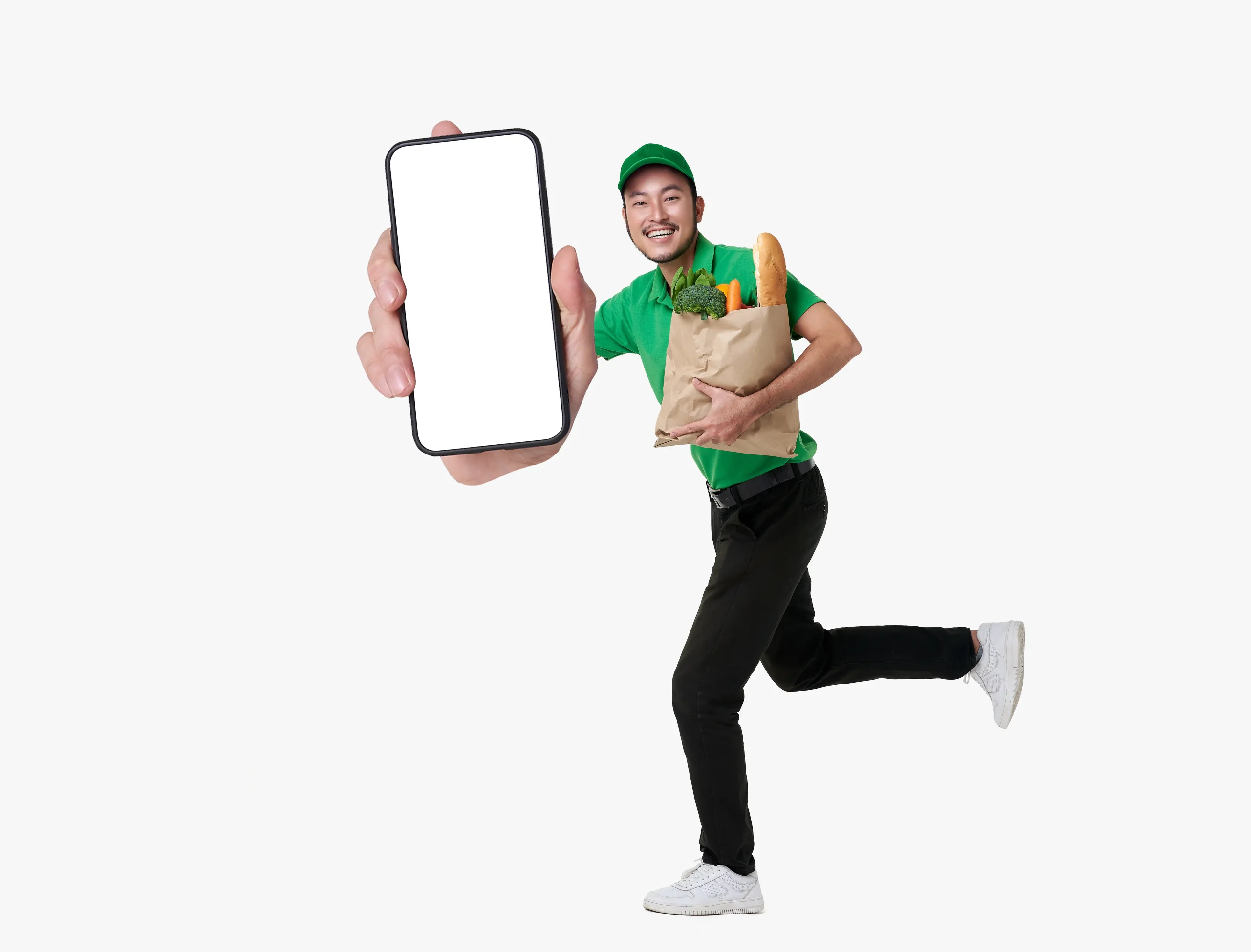 asian-delivery-man-showing-smartphone-application-holding-fresh-food-paper-bag-running