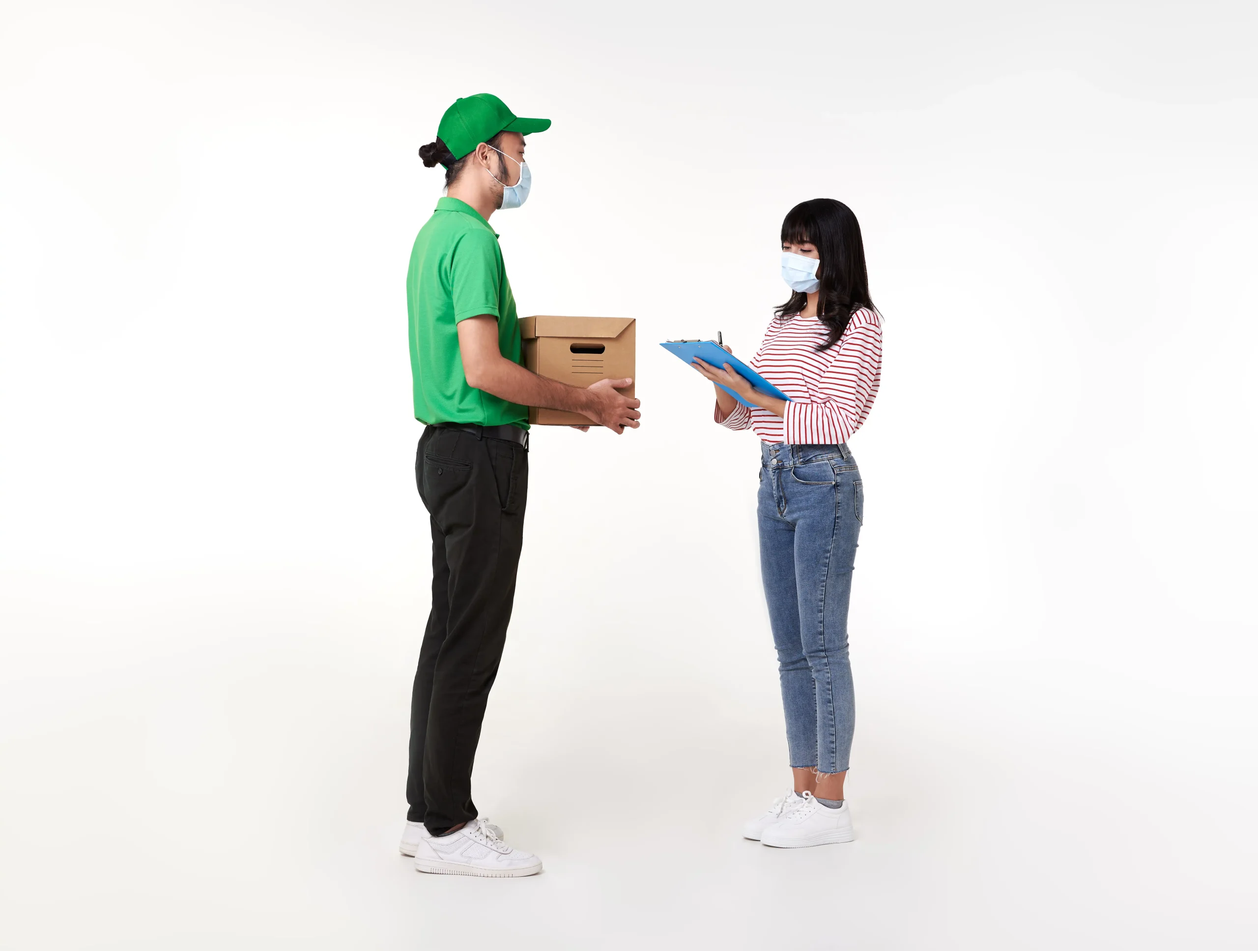 asian-delivery-man-wearing-face-mask-green-uniform-with-parcel-box-give-woman-costumer-white